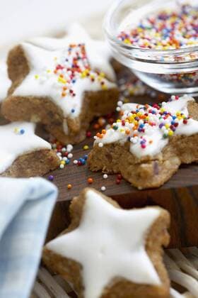 Cinnamon star cookies on chopping board, close up  KNF000689
