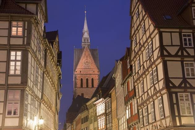 Germany, Hannover, Kramer Street, Row of houses and church at dusk  WDF00698