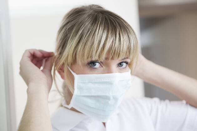 Germany, Dentist with surgical mask model released property released  FMKYF000236
