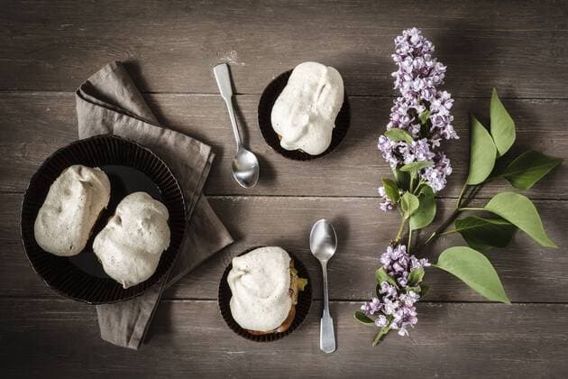 Gluten-free rhubarb cake with meringue, tee spoons and blossoms of lilac, elevated view  EVGF000583