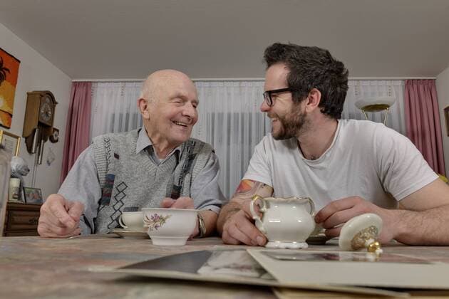 Grandfather and grandson drinking coffee at home model released property released  LAF000648