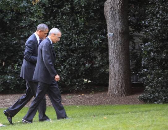 President Barack Obama (L) and John Podesta, counselor to the president, walk to the Oval Office on the South Lawn of the White House after a military senior leadership meeting at the Pentagon on October 8, 2014. Obama was optimistic that a joint world effort could contain the offensive of the Islamic State (ISIL ISIS).  WAX20141008109