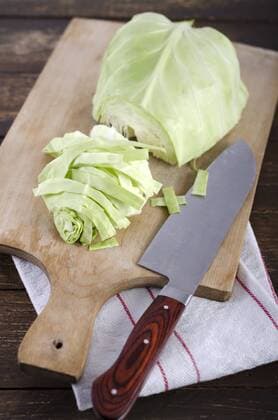Pointed cabbage on wooden table  ODF000602