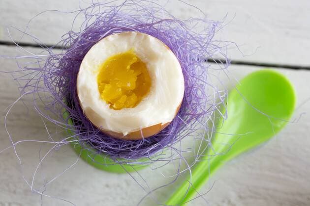 Boiled easter egg in green eggcup, egg spoon  SARF000261