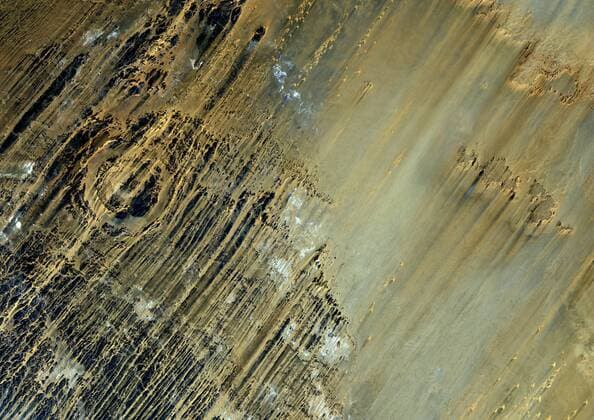 Aorounga Meteor Impact Crater, Chad, True Colour Satellite Image. True colour satellite image of Aorounga impact structure, Chad (age : 200 million years ; diameter : 17 km). Image taken on 22 February 1988 using LANDSAT data. 913_03_PO00427