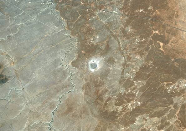Barringer Meteor Impact Crater, Arizona, Usa, True Colour Satellite Image. True colour satellite image of Barringer impact structure, Arizona, US (age : 49000 years ; diameter : 1186 km). Image taken on 1 July 1991 using LANDSAT data. 913_03_PO00431