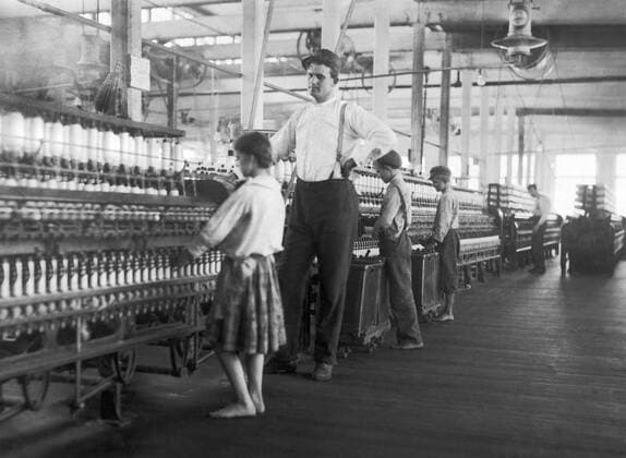 Yazoo City, Mississippi: May 1911 A young spinner being watched by the overseer at Yazoo City Yarn Mills. 990_05_6-Child-W_7HR