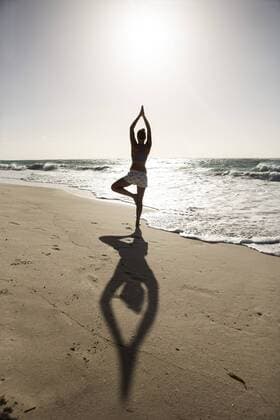 Caribbean, Barbados, Silver Sands beach, woman practicing yoga model released Symbolfoto  SKF001563