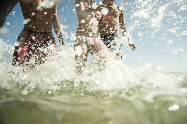 Three teenagers enjoying beachlife model released Symbolfoto  UUF001682