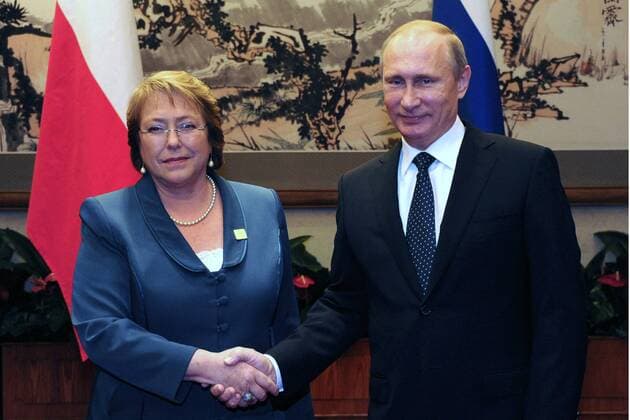 BEIJING, CHINA. NOVEMBER 9, 2014. Russia s president Vladimir Putin (R) and Chile s president Michelle Bachelet shake hands as they meet ahead of the 26th Asia Pacific Economic Cooperation (APEC) summit in Beijing. Mikhail Klimentyev TASS  RE1544B8