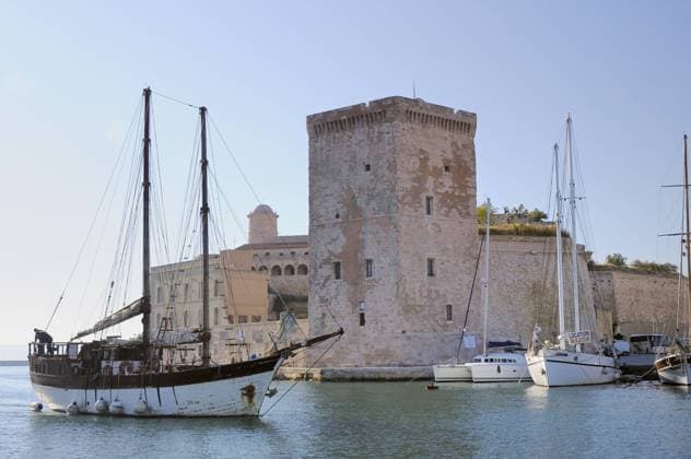Wooden schooner Liberte 3 passing Fort Saint-Jean as it enters Marseille Old Port harbour, France, May 2010.  1315193 NickxUpton