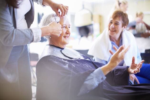 Female hairdresser cutting hair of senior woman model released Symbolfoto property released  ZEF001015