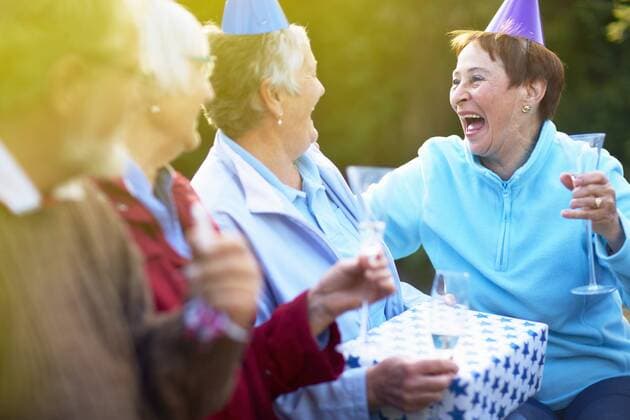 Senior friends on a birthday garden party model released Symbolfoto  ZEF001032
