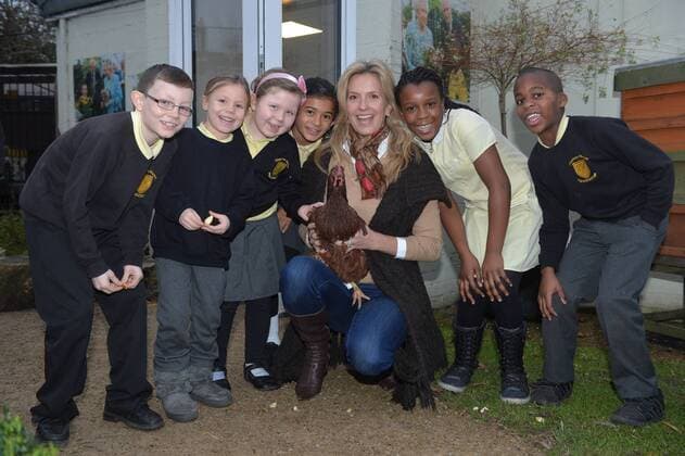 . 18 12 2014. London, United Kingdom. Penny Lancaster visits Charlton Manor Primary School where the Mayors Fund initiative Penny for London is raising money to fund breakfasts for school children. Penny Lancaster visits the school s chickens during breakfast club with students at Charlton Manor Primary School xBenxStevensx xi-Imagesx IIM-3778-0005