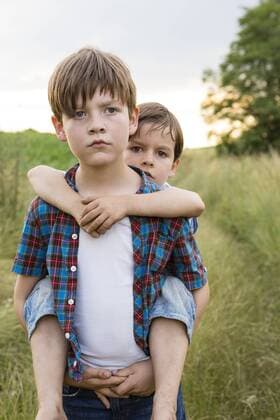 Portrait of of two serious looking little boys model released Symbolfoto  FKIF000053