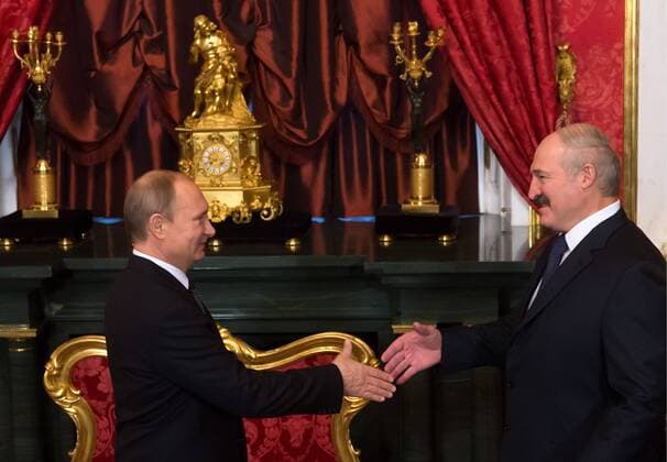 MOSCOW, RUSSIA. DECEMBER 23, 2014. Presidents Vladimir Putin (L) of Russia and Alexander Lukashenko of Belarus shake hands ahead of a session of the Collective Security Council of the Collective Security Treaty Organization (CSTO) at Moscow s Kremlin. Ilya Pitalev TASS  RE158955