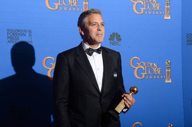 ENTERTAINMENT RED CARPET Golden Globe Awards - Preisträger George Clooney appears backstage with the Cecil B. DeMille Award during the 72nd annual Golden Globe Awards at the Beverly Hilton Hotel in Beverly Hills, California on January 11, 2015.  LAP20150111507 JIMxRUYMEN