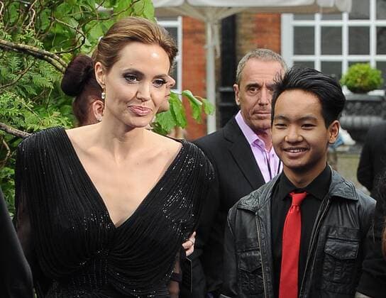Angelina Jolie and Maddox Jolie-Pitt attend a private reception as costumes and props from Disney s Maleficent are exhibited in support of Great Ormond Street Hospital at Kensington Palace, London. MAY 8TH 2014  PTYx142198