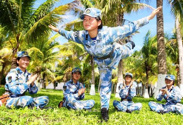 Female soldiers celebrate the International Women s Day by taking part in an entertainment activity at the break of a drill on the Yongxing Island, the Xisha Islands on the South China Sea, March 8, 2015. ) (lfj) CHINA-XISHA ISLANDS-FEMALE SOLDIERS (CN) ZhaoxXianghu 
