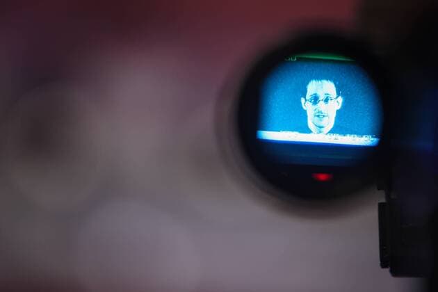 (150318) -- HANOVER, March 18, 2015 -- Edward Snowden is seen on the display of a camera during a live remote interview at CeBIT 2015, the world s top trade fair for information and communication technology, in Hanover, Germany, on March 18, 2015. ) GERMANY-HANOVER-CEBIT 2015-EDWARD SNOWDEN ZhangxFan 