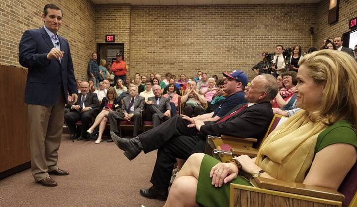 April 1, 2015 - Sioux City, IOWA, USA - HEIDI CRUZ, far right, smiles at her husband U.S. Sen TED CRUZ, standing left, as he speaks at Morningside College in Sioux City, Iowa, April 1, 2015, on one of his first stops nationwide after announcing his intention to run for the Office of President. Sioux City USA - ZUMAm41_