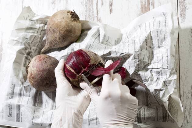 Woman with rubber gloves peeling beetroot model released Symbolfoto  MAEF009906