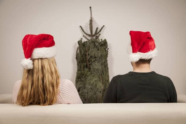 couple with caps on christmas eve