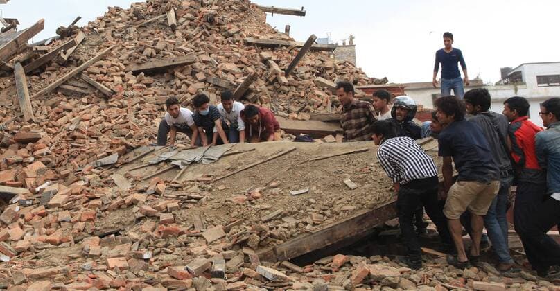(150425) -- KATHMANDU, April 25, 2015 -- People try to lift the debris from a temple at Hanumandhoka Durbar Square after an earthquake in Kathmandu, capital of Nepal, on April 25, 2015. Death toll in Nepal climbed to 711, the country s Home Ministry said Saturday afternoon, hours after a major earthquake struck the country. ) NEPAL-KATHMANDU-EARTHQUAKE-AFTERMATH SunilxSharma 