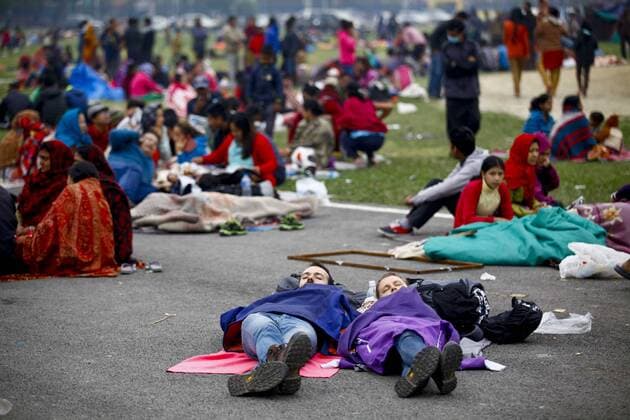 (150426) -- KATHMANDU, April 26, 2015 -- Tourists sleep at an open space after an earthquake in Kathmandu, Nepal, April 26, 2015. The death toll from a powerful earthquake which struck Nepal on Saturday has climbed to 1, 896 including 723 in the Nepal s capital Kathmandu, a senior government official told Xinhua on Sunday morning. ) NEPAL-EARTHQUAKE-AFTERMATH PratapxThapa 
