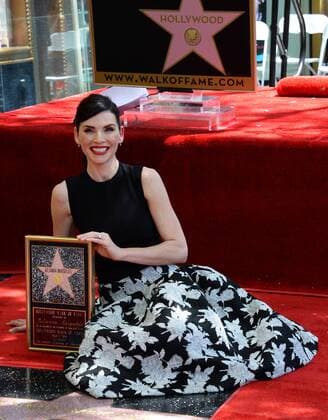Actress Julianna Margulies holds a replica during an unveiling ceremony honoring her with the 2,550th star on the Hollywood Walk of Fame in Los Angeles on May 1, 2015.  LAP2015050104 JIMxRUYMEN