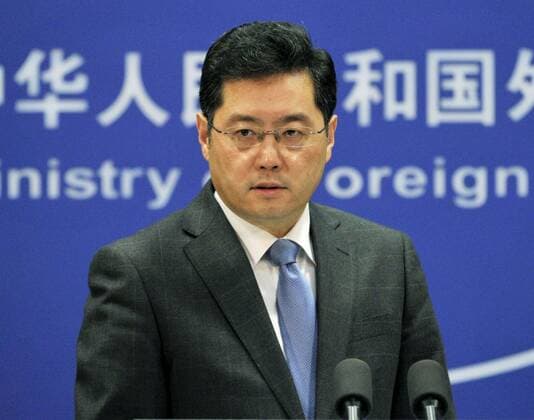 BEIJING, China - Chinese Foreign Ministry spokesman Qin Gang listens to a reporter s question at a regular press conference in Beijing on April 24, 2014. He reacted sharply to U.S. President Barack Obama s first public statement on defending Japan in the event of a conflict between the country and China over a group of islands in the East China Sea at the heart of a bitter dispute between the two Asian countries.  0428031