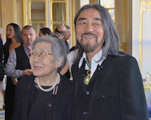 PARIS, France - Japanese fashion designer Yohji Yamamoto (front R), pictured with his mother Fumi, after receiving the Commander of the Order of the Arts and Letters, France s top honor for arts, from the French culture ministry in Paris on Oct. 3, 2011.  1004050