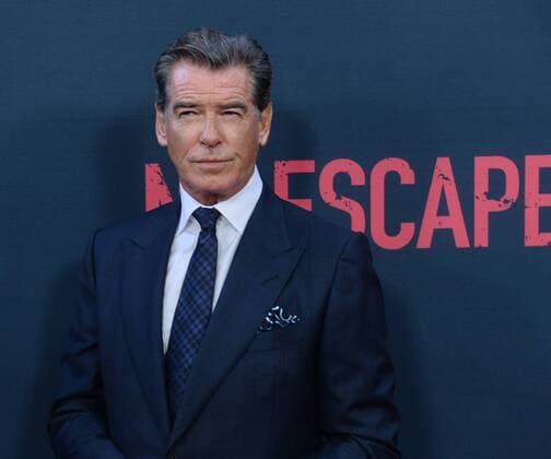 Cast member Pierce Brosnan attends the premiere of the motion picture thriller No Escape at Regal Cinemas LA Live in Los Angeles on August 17, 2015. Storyline: In their new overseas home, an American family soon finds themselves caught in the middle of a coup, and they frantically look for a safe escape in an environment where foreigners are being immediately executed.  LAP2015081701 JIMxRUYMEN