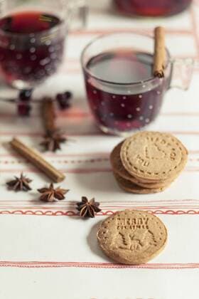 Home-baked almond biscuits, glasses of mulled wine and spices  SBDF002162