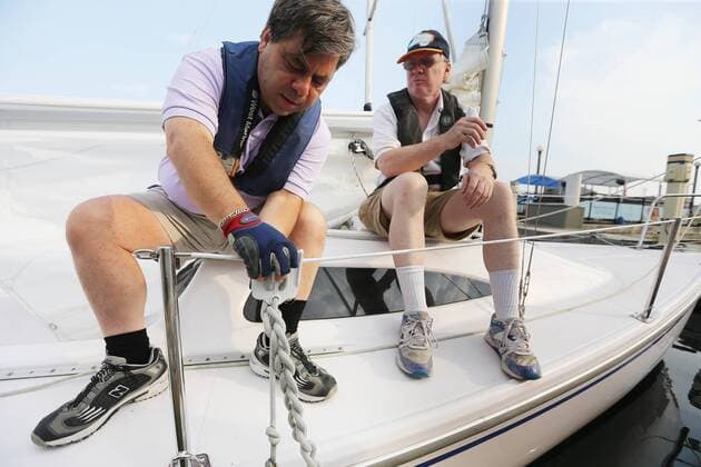 Sept. 3, 2015 - Toronto, ON, Canada - TORONTO, ON- SEPTEMBER 3 - David Brown, right and training partner Chris Jonas ready the boat for a training sail in Humber Bay. David Brown is a blind sailor from Toronto who nest week will compete at the world championships in Chicago. He competes with another blind sailor Brian Arthur and with the help of two others who will guide them. in Toronto Harbour in Toronto. September 3, 2015. Toronto Canada  - ZUMAt14_