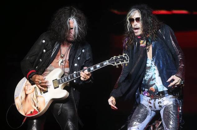 MOSCOW, RUSSIA. SEPTEMBER 5, 2015. Lead guitarist Joe Perry (L) and lead singer Steven Tyler of the American rock Band Aerosmith perform in Lubyanka Square marking Moscow City Day. Vyacheslav Prokofyev TASS  TS00D175
