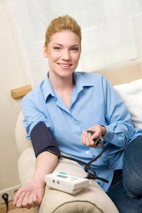 Woman measuring herself blood pressure.  1272347