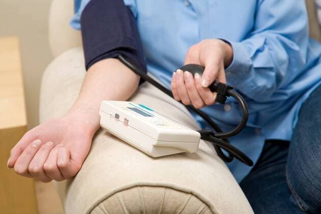 Woman measuring herself blood pressure.  1272348