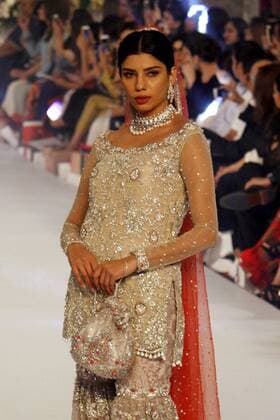 (150917) -- LAHORE, Sept. 17, 2015 -- A model presents a creation by designer Zarmish Dara on the first day of Pakistan Fashion Designing Council (PFDC) bridal fashion week in eastern Pakistan s Lahore, Sept. 16, 2015. ) PAKISTAN-LAHORE-BRIDAL FASHION WEEK JamilxAhmed 