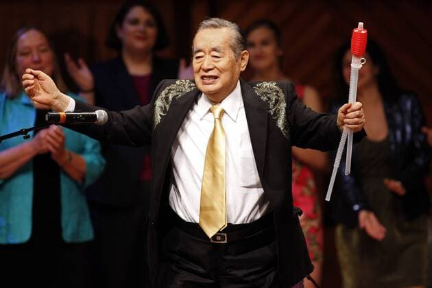 Japanese inventor Yoshiro Nakamatsu, also known as Dr. NakaMats, sings a song during the 2015 Ig Nobel Prize ceremony at Harvard University in Cambridge, Massachusetts on September 17, 2015. The prizes which are awarded by the Annals of Improbable Research are intended to celebrate the unusual, honor the imaginative and spur people s interest in science, medicine, and technology.  BOS2015091711 MATTHEWxHEALEY