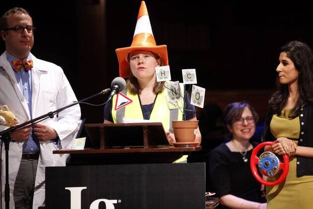 Helen F. Ashdown (C) of University of Oxford accepts her team s 2015 Ig Nobel Prize in Diagnostic Medicine for their work in determining that acute appendicitis can be accurately diagnosed by the amount of pain evident when the patient is driven over speed bumps, at the awards ceremony at Harvard University in Cambridge, Massachusetts on September 17, 2015. The prizes which are awarded by the Annals of Improbable Research are intended to celebrate the unusual, honor the imaginative and spur people s interest in science, medicine, and technology.  BOS2015091714 MATTHEWxHEALEY