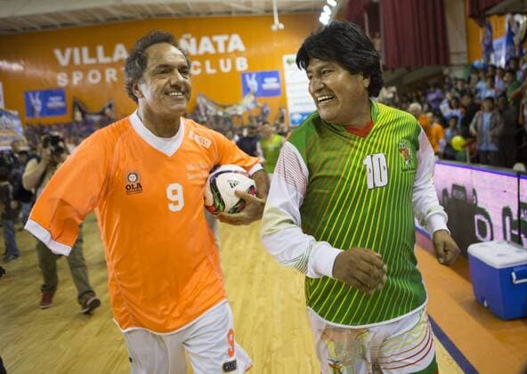 (150918) -- BERNAL, Sept. 17, 2015 -- Bolivian President Evo Morales (R) and Buenos Aires Province Governor and presidential candidate for the Victory Front Daniel Scioli react during a soccer match at Villa la Nata in Benavides City, Argentina, Sept. 17, 2015. Evo Morales was in Argentina to support Daniel Scioli s campaign. Martin Zabala) (azp) ARGENTINA-BENAVIDEZ-BOLIVIA PRESIDENT e MARTINxZABALA 