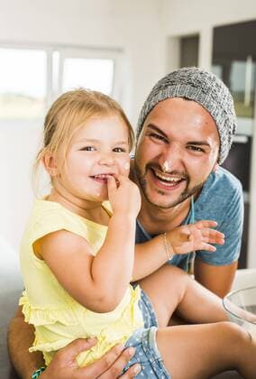 Happy father and daughter baking in kitchen model released Symbolfoto property released  UUF005178
