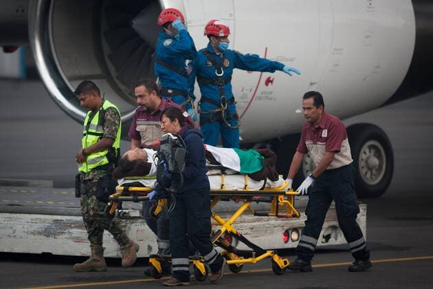 (150918) -- MEXICO CITY, Sept. 18, 2015 -- Medical staff moves one of the Mexican tourists injured in Egypt, upon their arrival at the Presidential Hangar at Mexico City s International Airport, in Mexico City, capital of Mexico, on Sept. 18, 2015. The six Mexicans who survived the bomb attack perpetrated against a group of tourists in Egypt on Sept. 13, arrived on Friday in Mexico accompanied by their realtives. ) MEXICO-MEXICO CITY-EGYPT-SECURITY-TRANSFER PEDROxMERA 