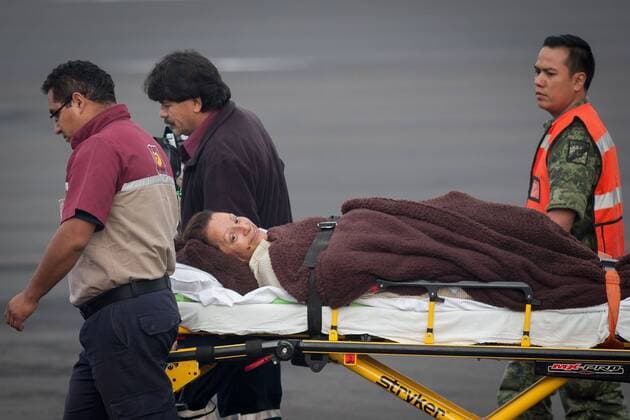 (150918) -- MEXICO CITY, Sept. 18, 2015 -- Medical staff moves in stretcher one of the Mexican tourists injured in Egypt, upon their arrival at the Presidential Hangar at Mexico City s International Airport, in Mexico City, capital of Mexico, on Sept. 18, 2015. The six Mexicans who survived the bomb attack perpetrated against a group of tourists in Egypt on Sept. 13, arrived on Friday in Mexico accompanied by their realtives. ) MEXICO-MEXICO CITY-EGYPT-SECURITY-TRANSFER PEDROxMERA 