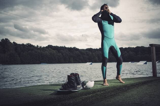 Young wakeboarder preparing at lakeshore model released Symbolfoto property released  MADF000489