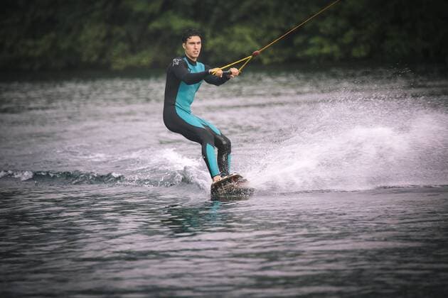 Young man wakeboarding model released Symbolfoto property released  MADF000495