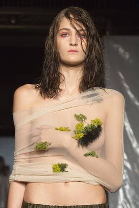 London, UK. 19 09 2015. Runway show of designer James Kelly at Fashion Scout during London Fashion Week. The designs feature moss and fine feathers. London Fashion Week, James Kelly at Fashion Scout, London, UK 