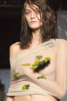 London, UK. 19 09 2015. Runway show of designer James Kelly at Fashion Scout during London Fashion Week. The designs feature moss and fine feathers. London Fashion Week, James Kelly at Fashion Scout, London, UK 