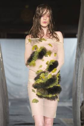 London, UK. 19 09 2015. Runway show of designer James Kelly at Fashion Scout during London Fashion Week. The designs feature moss and fine feathers. London Fashion Week, James Kelly at Fashion Scout, London, UK 